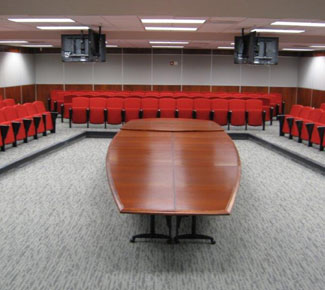 Transformable Boat-shaped table in a spacious conference center - CLOSED for generic meeting.